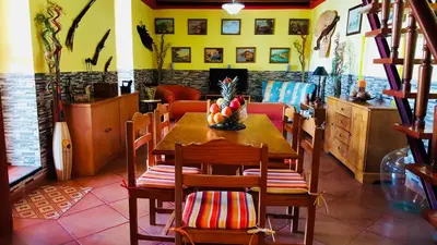 a dining room with a table with fruit on it at Sea View Villa in Calheta