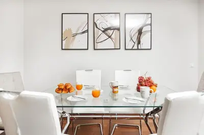 a dining room with a glass table with fruit on it at Premium Avenue Two Bedrooms Apt in Funchal