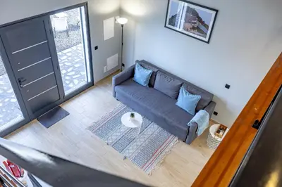 a living room with a couch and a window at Santana Trail House - Pico Ruivo in Santana