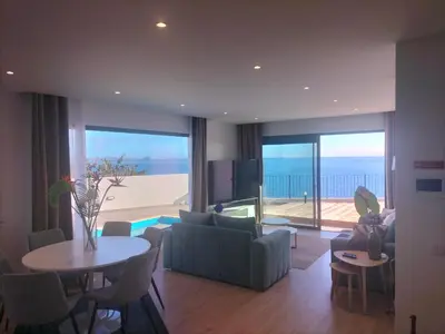 a living room with a couch and a table at Villa Atlantic Lodjadis in Gaula