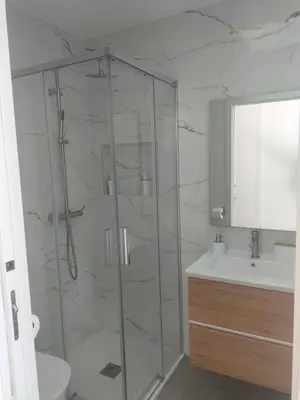 a bathroom with a shower and a toilet and a sink at Villa Atlantic Lodjadis in Gaula