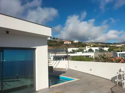 a view from the balcony of a house with a swimming pool at Villa Atlantic Lodjadis in Gaula