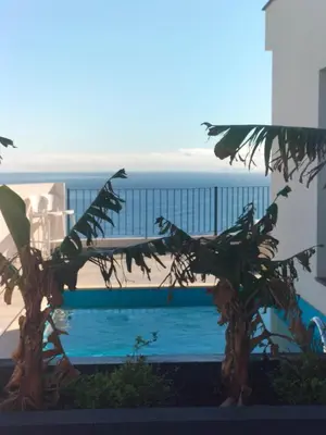 a swimming pool with a view of the ocean at Villa Atlantic Lodjadis in Gaula