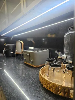 a kitchen with a counter with a toaster and jars at Villa Barros in Câmara de Lobos