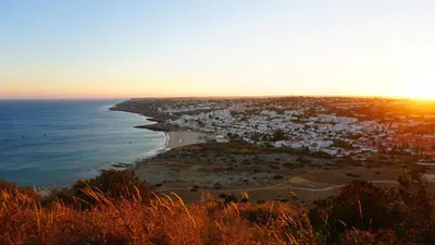 an aerial view of a beach and the ocean at Baia da Luz - Luz Suite in Luz