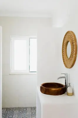 a bathroom with a wooden sink and a mirror at Surf & Yoga Retreats Portugal in Aljezur