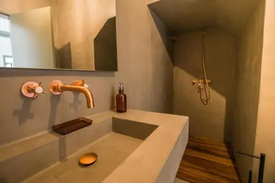 a bathroom with a sink and a mirror at Cabasina Bordeira in Bordeira