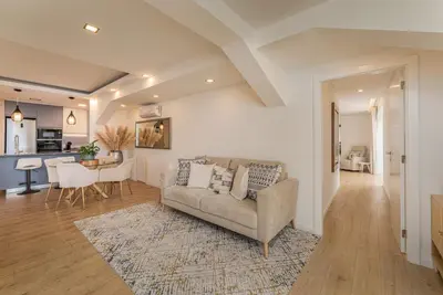 a living room with a couch and a table at The Viewpoint by Eurostay in Ribeira Brava