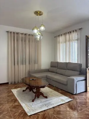 a living room with a couch and a coffee table at Casa estrelicia II in Relógio do Poiso