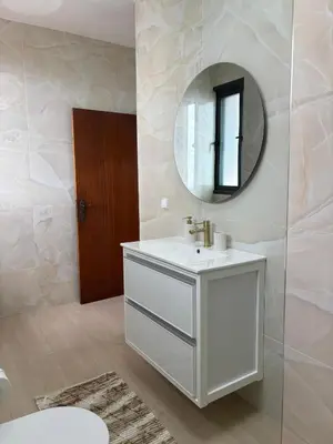 a white bathroom with a sink and a mirror at Casa estrelicia II in Relógio do Poiso
