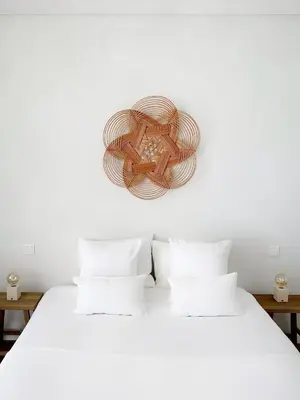 a bedroom with a white bed with two pillows at B View Madeira - Ocean & Bay View Apartment in Câmara de Lobos
