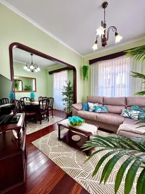 a living room with a couch and a table at O Cantinho do Zé - Signature Funchal in Funchal