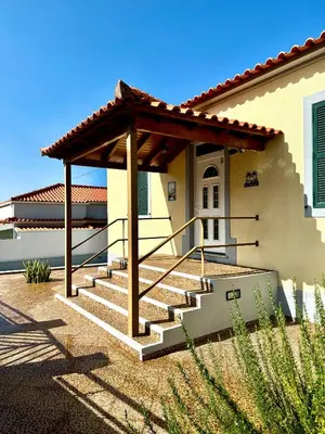 a house with a porch and stairs in front at O Cantinho do Zé - Signature Funchal in Funchal