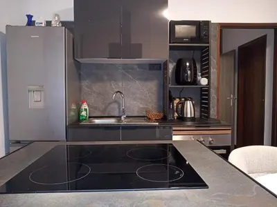 a kitchen with a sink and a counter top at Casa de férias Funchal in Nossa Senhora do Monte