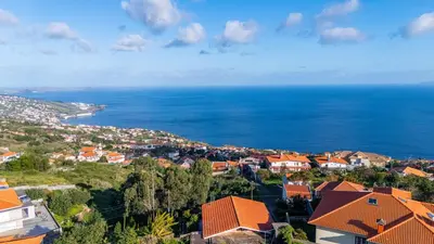 an aerial view of a city and the ocean at Vivenda Paz Lobo by YOUR KEY MADEIRA in Gaula