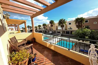 a balcony with a view of a swimming pool at SV Villa Burgau in Burgau