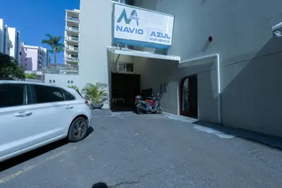 a white car parked in front of a building at Apartamento Navio Azul in Funchal