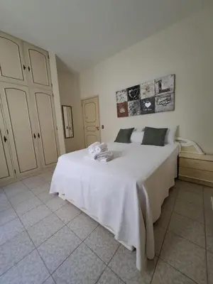 a bathroom with a toilet and a sink and a mirror at Rosolamar Villa with Ocean View in Câmara de Lobos