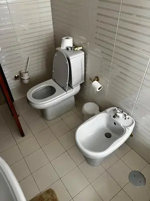 a white bathroom with a tub and a sink at Rosolamar Villa with Ocean View in Câmara de Lobos