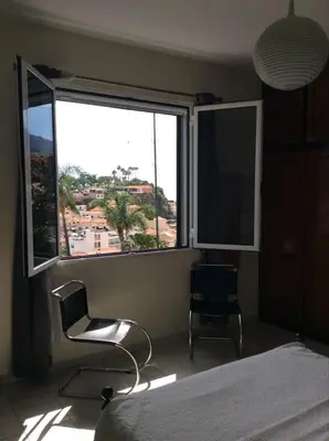 a bathroom with a toilet and a sink and a mirror at Rosolamar Villa with Ocean View in Câmara de Lobos
