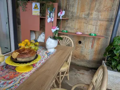 a table with a plate of food on it at CasAmor - Romantic Ocean View Studio in Santa Cruz