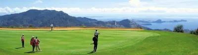 a group of people playing golf on a golf course at CasAmor - Romantic Ocean View Studio in Santa Cruz