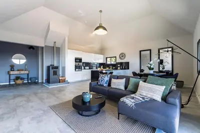 a living room with a couch and a table at Passaras - countryside retreat in west of island in Ponta do Pargo