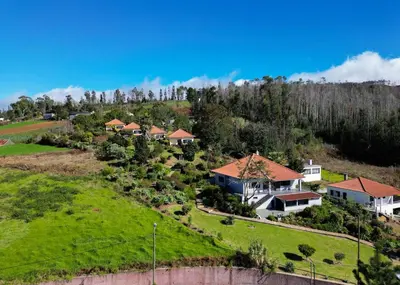 an aerial view of a house on a hill at Passaras - countryside retreat in west of island in Ponta do Pargo