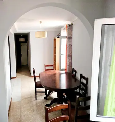 a dining room with a table and chairs at Funchal Pink Hostel in Funchal