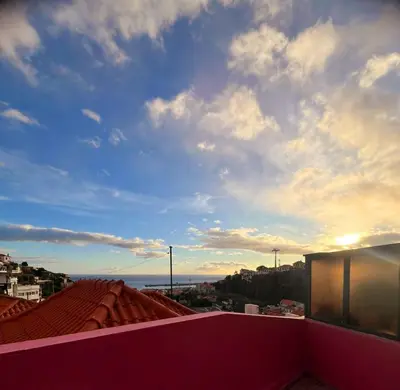 a view of the sky from the roof of a building at Funchal Pink Hostel in Funchal
