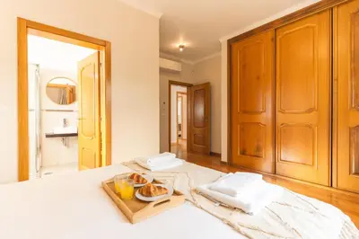 a room with a table with a tray of food on it at Villa Valentina by Atlantic Holiday in Ponta do Sol