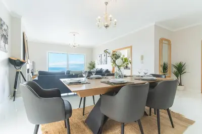 a dining room with a table and chairs at Villa Valentina by Atlantic Holiday in Ponta do Sol