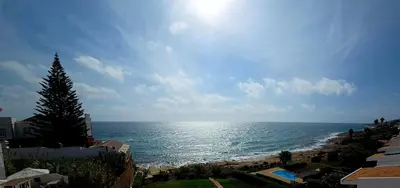 a view of the ocean on a sunny day at Vivenda Chagas in Luz