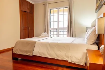 a bedroom with a bed with a teddy bear on it at View to the Valley, By OP in Senhora do Rosário