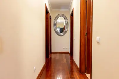 a hallway with a mirror and a wooden floor at View to the Valley, By OP in Senhora do Rosário