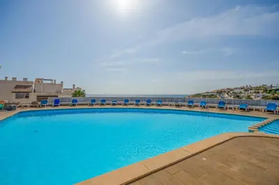 an aerial view of a resort and the ocean at Tenório Beach Apartment in Lagos