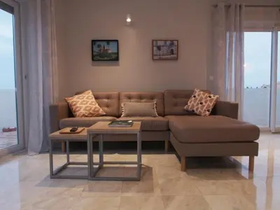 a living room with a couch and a coffee table at Breathtaking ocean views in Praia da Luz #1992 in Luz