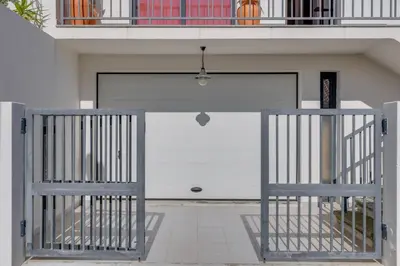 a garage door with a gate in front of it at Andrade's Villa by Holiday Rental Madeira in Caniço