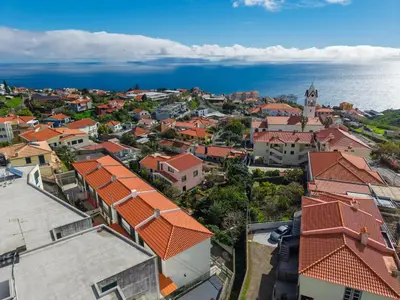 an aerial view of a town with orange roofs at Andrade's Villa by Holiday Rental Madeira in Caniço
