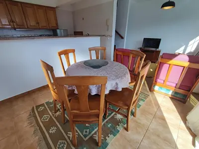 a dining room with a table and chairs at Madeira V2 Porto da Cruz in Porto da Cruz