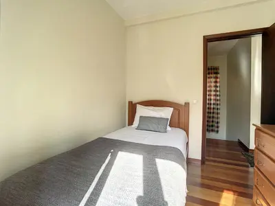 a bedroom with a bed with a pillow on it at Villa Bella Vista by AH in São Vicente