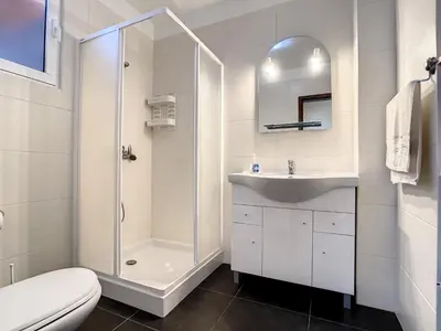 a bathroom with a shower and a sink and a toilet at Villa Bella Vista by AH in São Vicente