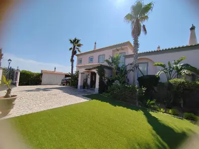 a bathroom with a large sink and a tub and a tubermott at Nice Villa in Budens with pool in Budens