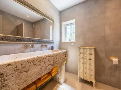 a bathroom with a sink and a mirror at Nice Villa in Budens with pool in Budens
