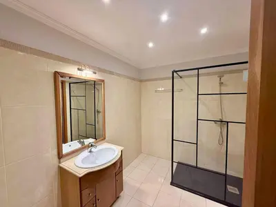 a bathroom with a sink and a glass shower at Vista Verde in Estreito de Câmara de Lobos