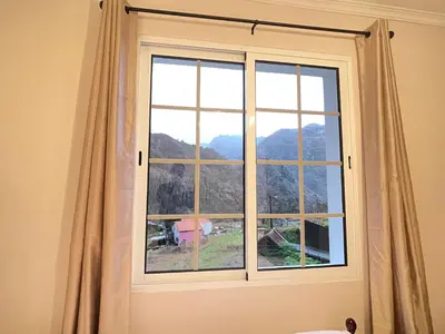 a window with a view of a mountain at Forest View Countryside in Serra de Água