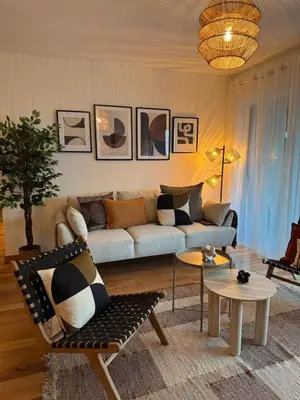 a living room with a couch and a table at Ocean View Oasis Funchal with Parking in Funchal
