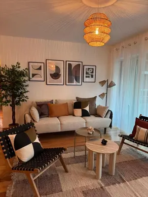 a living room with a couch and a table at Ocean View Oasis Funchal with Parking in Funchal