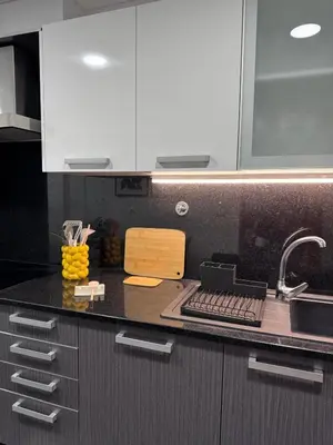 a kitchen with a sink and a counter top at Ocean View Oasis Funchal with Parking in Funchal