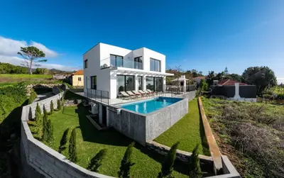 an image of a house with a swimming pool at OurMadeira - Casa Laranja in Prazeres